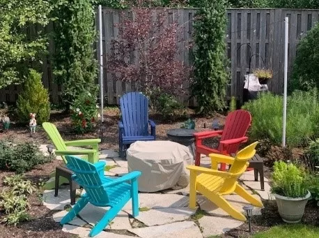 Outdoor living Adirondack chairs and fire pit by Hearth and Home